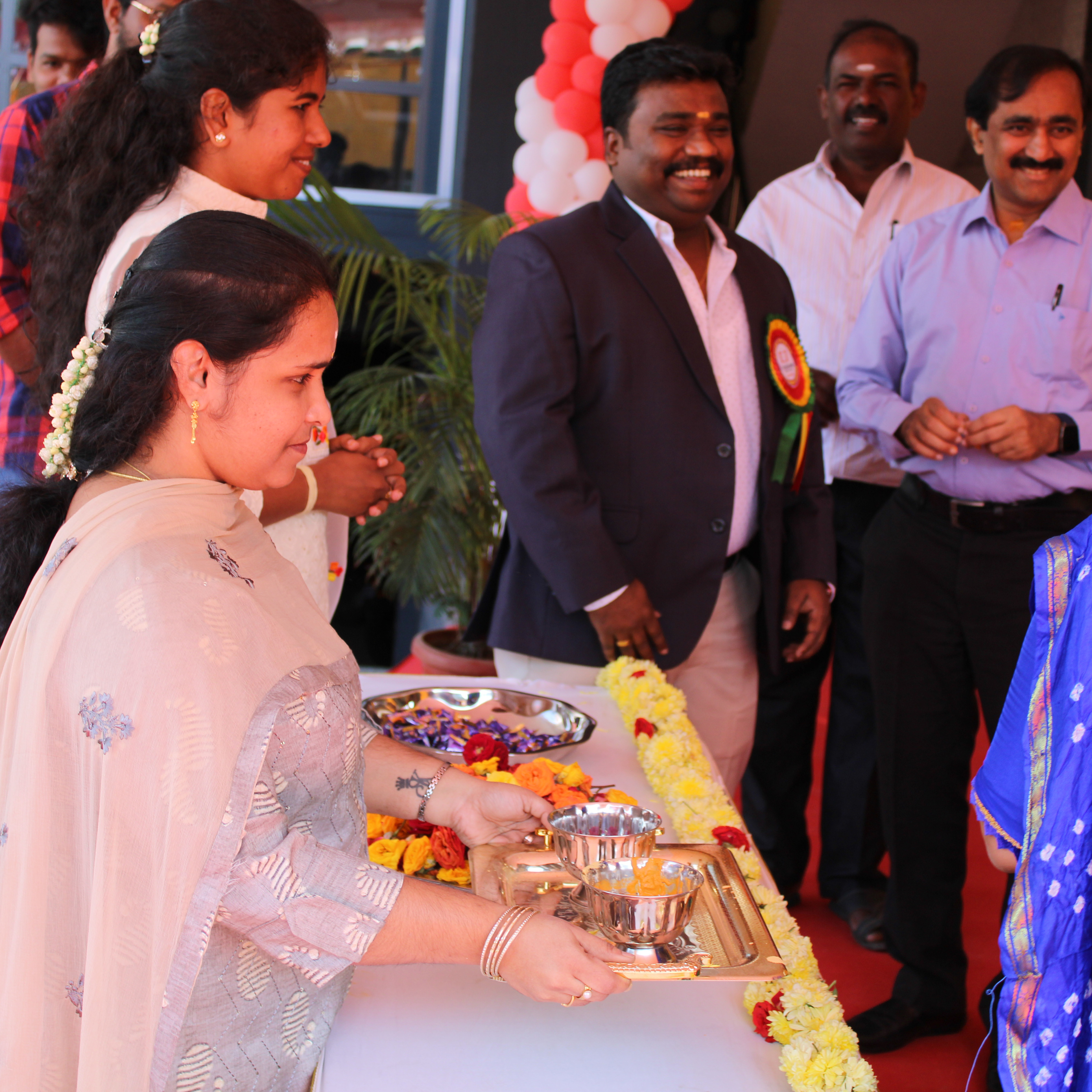 K square edutainment office inauguration a woman welcoming all.