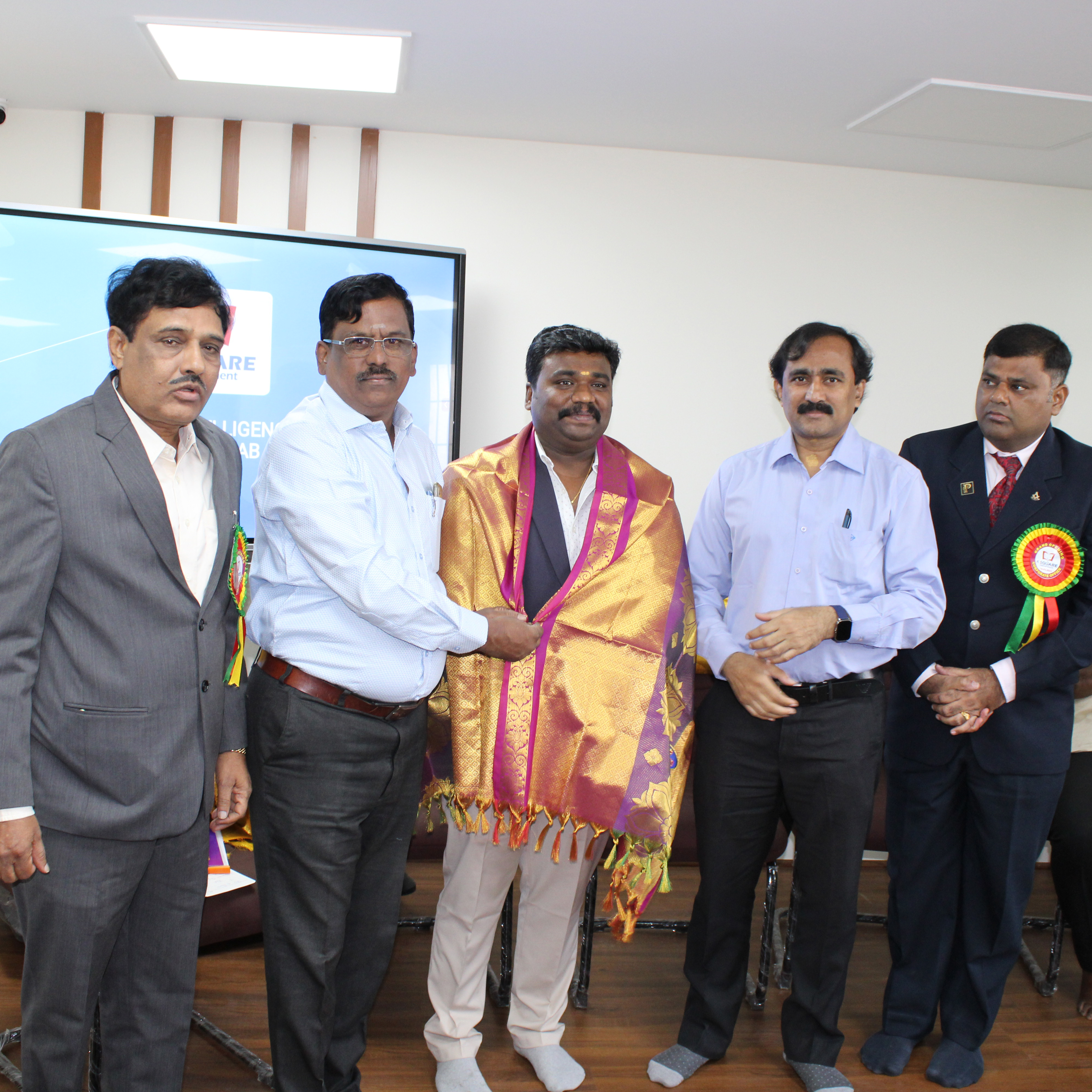 A group of people appreciating a man.