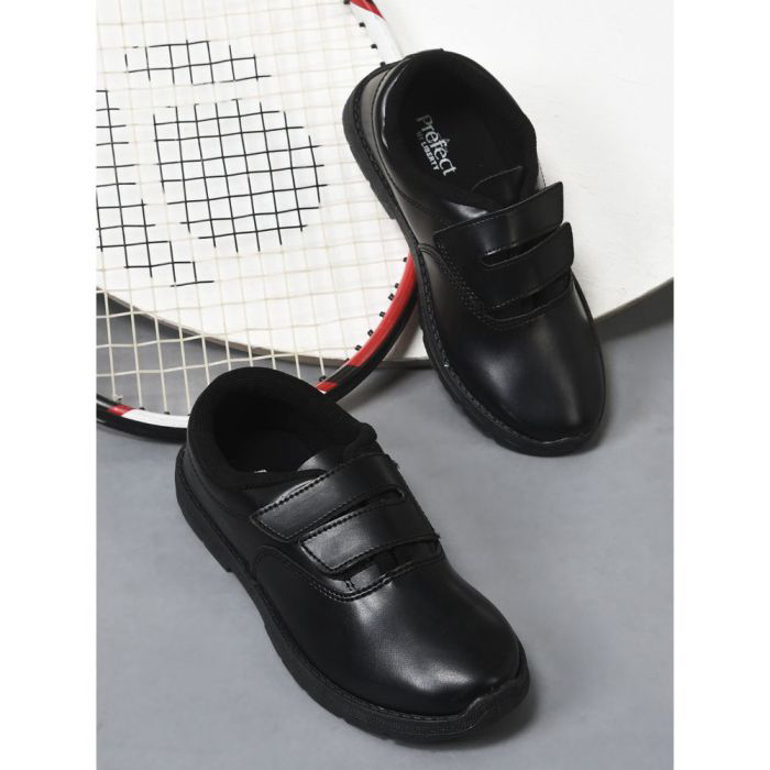 Black leather girl’s shoes by K Square Edutainment, perfect for school.