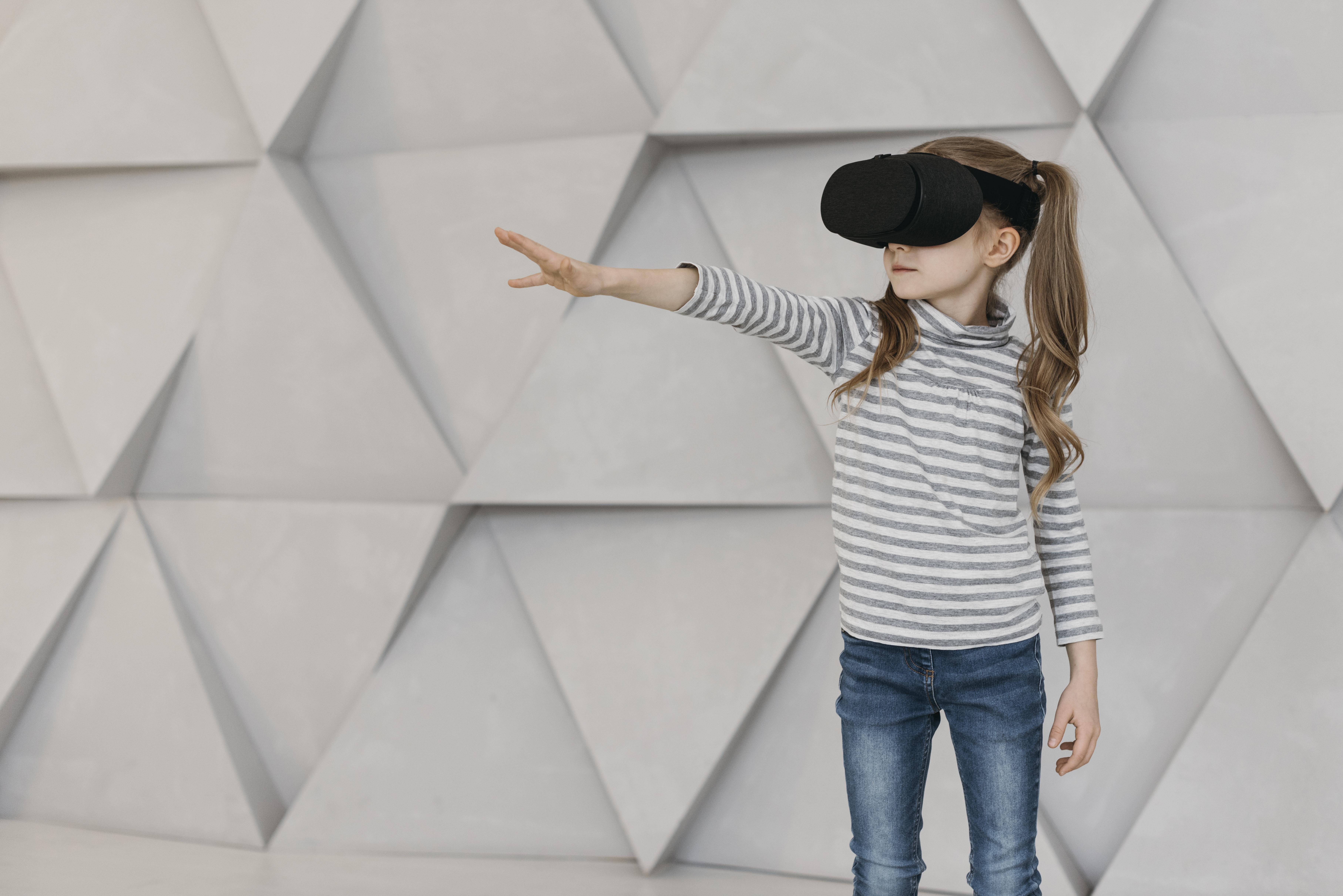A young girl immersed in a virtual reality experience through a headset.